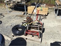 d1 pallet of push reel mowers and flower bed