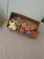 Box of old and older child alphabet blocks