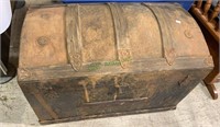 Antique dome top trunk, medium size, on wheels,