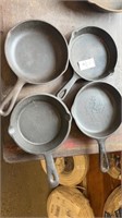 4 small cast iron baby skillets