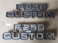 Two Ford "F-250 Custom" Badges