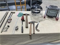 Tools, face shield, light, hammer, pry bar