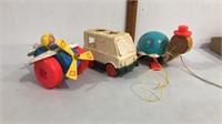 3 vintage pull toys.  2 are fisher price and 1 is