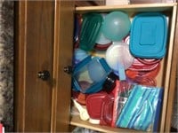 contents of drawer - many lids to things in cabine