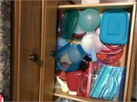 contents of drawer - many lids to things in cabine