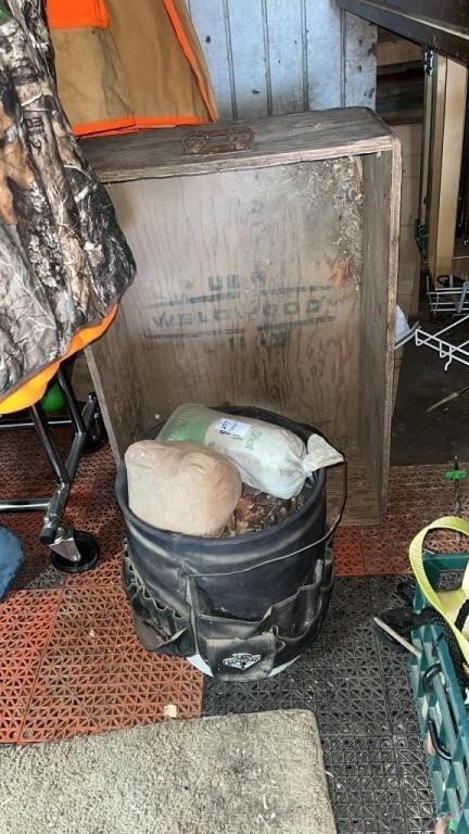 Bucket of sandbags and a wooden box