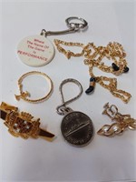 Lot to Include Key Chains, Tie Bar, and More