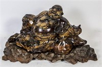 CARVED MARBLE BUDDHA ON WOODEN STAND