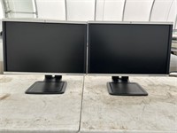 A pair of Hp Compaq LA2405x computer monitors