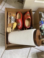 A box with wooden shoes, wood towel holder and a