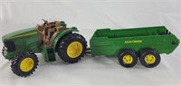 ERTL John Deere tractor and trailer toy.