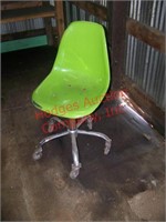 Green chair on casters