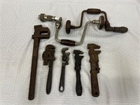 2 hand braces and 4 pipe wrenches