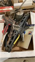 Jack, staple gun, oil can and various other tools