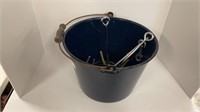 Metal pail with drill bits