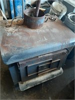 Earth Stove Cast iron wood stove w/ stove pipe