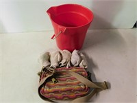 Plastic pail Fossit purse, five pr of gloves