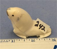 2" old style white ivory carved walrus, has a dryi