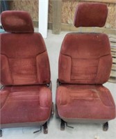 Pair of Red/ Burgundy Cloth Car Seats.