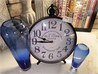 CLOCK AND BLUE VASES