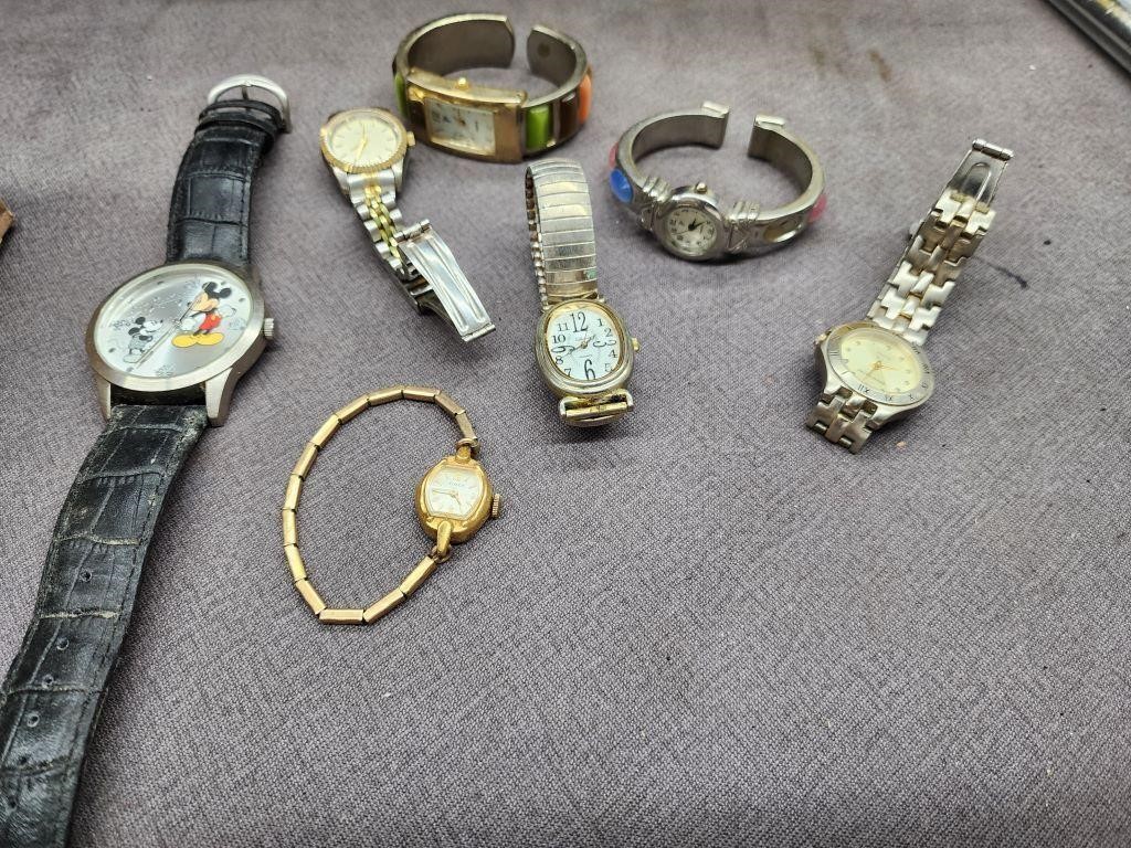7 watches.  Mickey Mouse,  Timex,  and more.