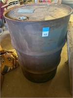 steel barrel 3/4 full of something liquid