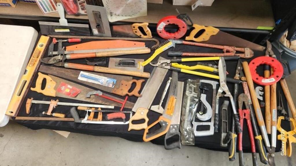 Lot of tools in a large plastic bin