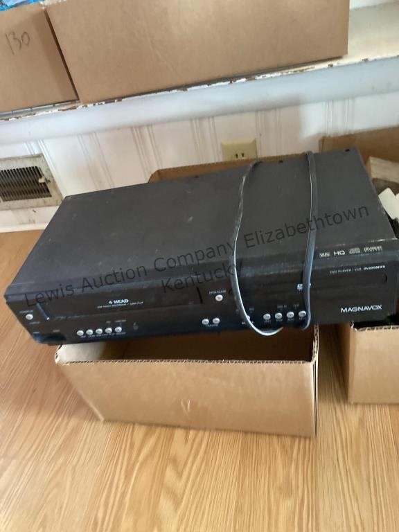 Magnavox DVD AND VHS PLAYER and a box with