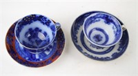 TWO FLOW BLUE CUPS AND SAUCERS