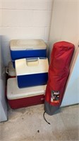 Four coolers, and an Ozark Trail, folding chair,