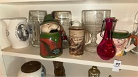Shelf lot of glass items including mugs vases etc