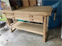 Wooden workbench with 4 drawers and a shelf