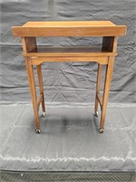 Vintage 1960's walnut bookstand on casters,