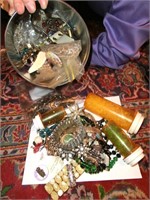 tin full of jewelry, parts, beads, and more