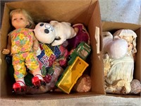 Two boxes of dolls and toys