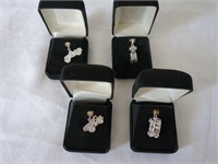FOUR STERLING SILVER CHARMS