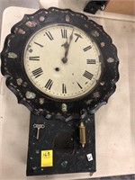 Black papier-mâché clock with mother of pearl