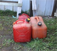 Four gas cans, some complete, some missing vent