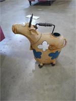 Cow watering can/yard ornament.