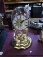 Glass incased Quartz clock.