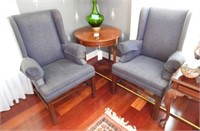 Pair of blue upholstered wingback chairs with