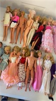16 Barbie dolls/ Ken/ baby dolls & clothes
