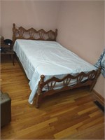 Full size wooden bed with rails only. Good