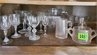 Shelf of glassware, sherry goblets, juice