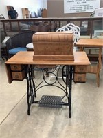 Ver nice standard treadle based sewing machine.