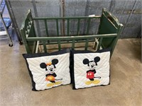 Doll Crib with Mickey and Minnie mouse pillows.