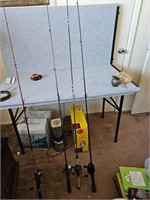 LOT OF THREE FISHING POLES WITH REELS