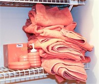 Stack pink towels and bathroom accessories