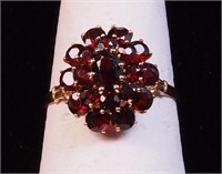 A 14K yellow gold and garnet ring,