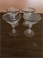 4 champaigne glasses with etched design and silver